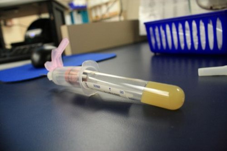 A vial with a needle before is seen in a file photo.