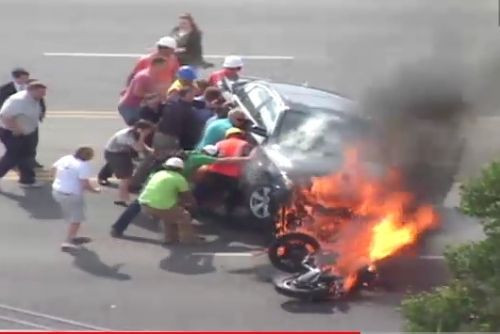 Bystanders lift car