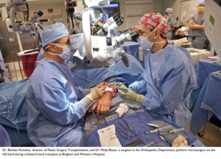 Doctors work on Mr. Mangino's right hand during a 12 hour hand transplant procedure at Brigham and Women's Hospital.