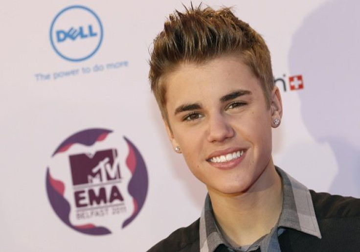 Canadian pop star Justin Bieber poses on arrival on the red carpet at the MTV Europe Music Awards show in Belfast November 6, 2011.