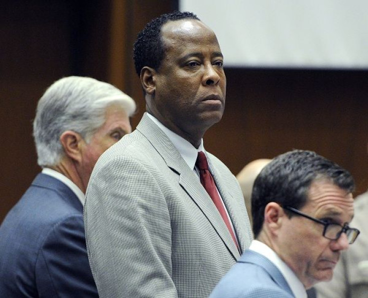 Defense attorney J. Michael Flanagan (L), Dr. Conrad Murray and defense attorney Ed Chernoff look on before closing arguements began in Murray's trial in the death of pop star Michael Jackson in Los Angeles November 3, 2011.
