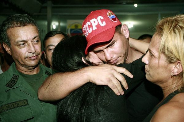 Baseball player Wilson Ramos hugs his girlfriend after being rescued in Valencia November 12, 2011.
