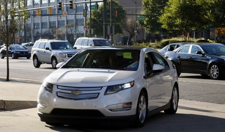 An electric Volt vehicle driven by General Motor Co Vice Chairman Tom Stephens pulls into the front of GM's world headquarters in Detroit, Michigan October 12, 2010.