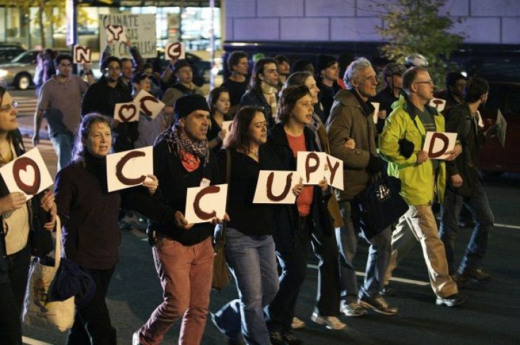 Occupy DC protesters march in the streets of Washington November 15, 2011.