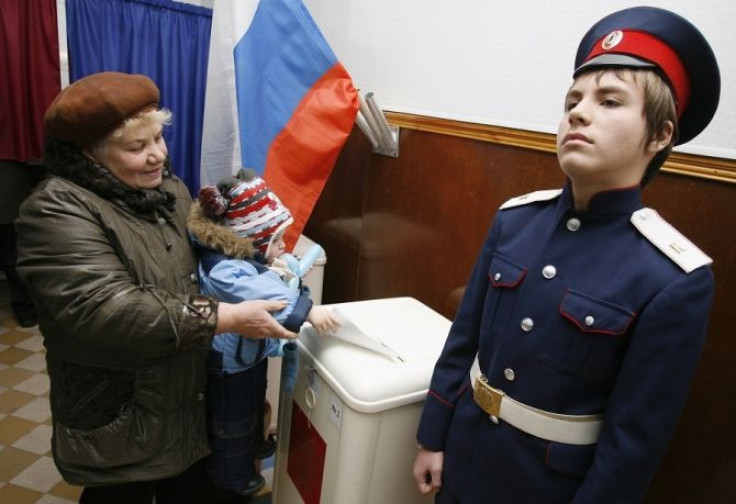 Woman casts ballot in Russian parliamentary election