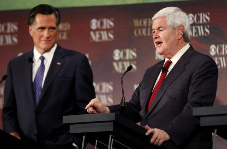 Republican presidential candidates former U.S. House of Representatives Speaker Newt Gingrich (R) speaks as former Massachusetts Governor Mitt Romney (L) listens during a South Carolina Republican party presidential debate in Spartanburg, South Carolina N