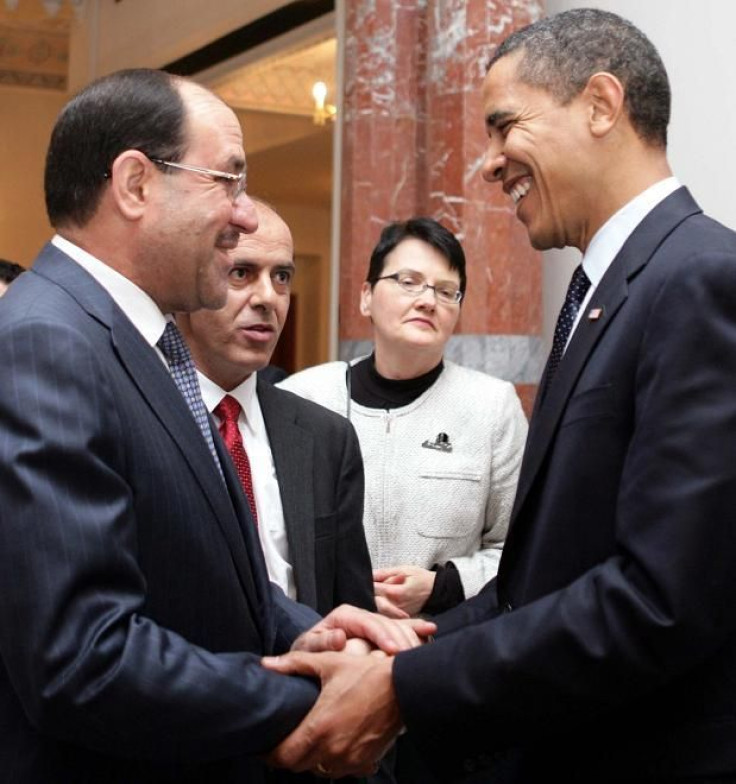 Iraqi Prime Minister Nouri al-Maliki (L) shakes hands with U.S. President Barack Obama during a meeting in Baghdad April 7, 2009.