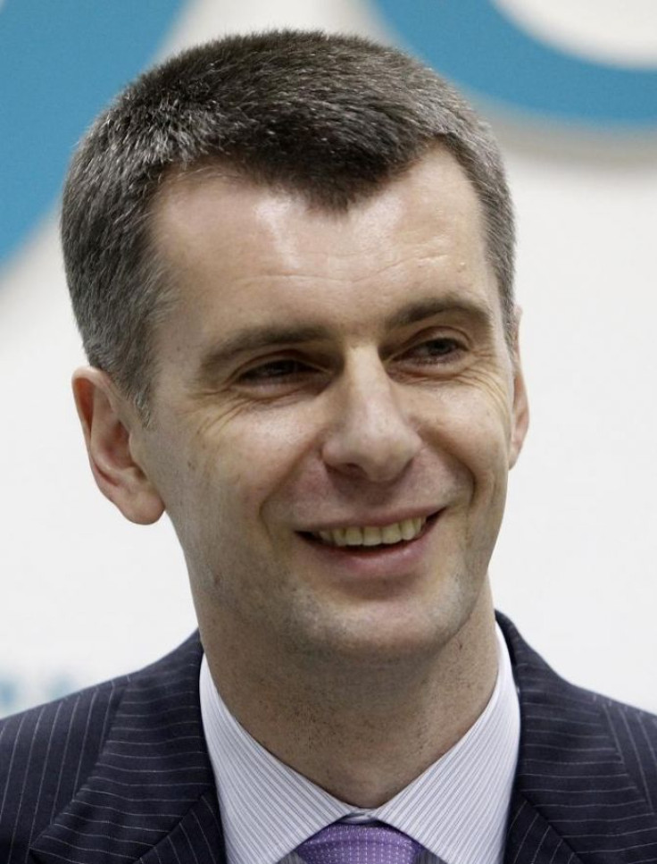 Russian billionaire Mikhail Prokhorov smiles during a news conference in Moscow
