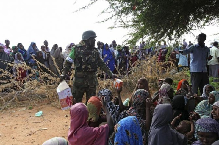 African Union (AU) peacekeeping forces distribute supplies of mosquito nets and medicine at a camp for internally displaced people (IDP) in Hodan district, south of the capital of Mogadishu August 24, 2011.