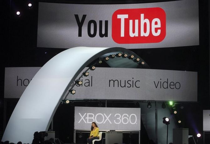 A woman demonstrates YouTube services on the Xbox game console at the Microsoft E3 XBOX 360 press briefing in Los Angeles, California June 6, 2011.