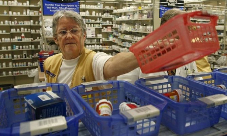 A pharmacist fills prescriptions at a drug store in Leesburg, Florida in this October 6, 2006 file photo.