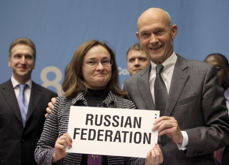 WTO Director general Lamy holds a sign with Nabiullina Minister of Economic Development after the signature of the accession of the Russian Federation as WTO member in Geneva