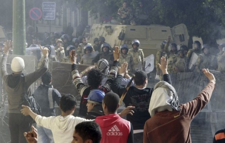 Protesters gesture to try to stop clashes
