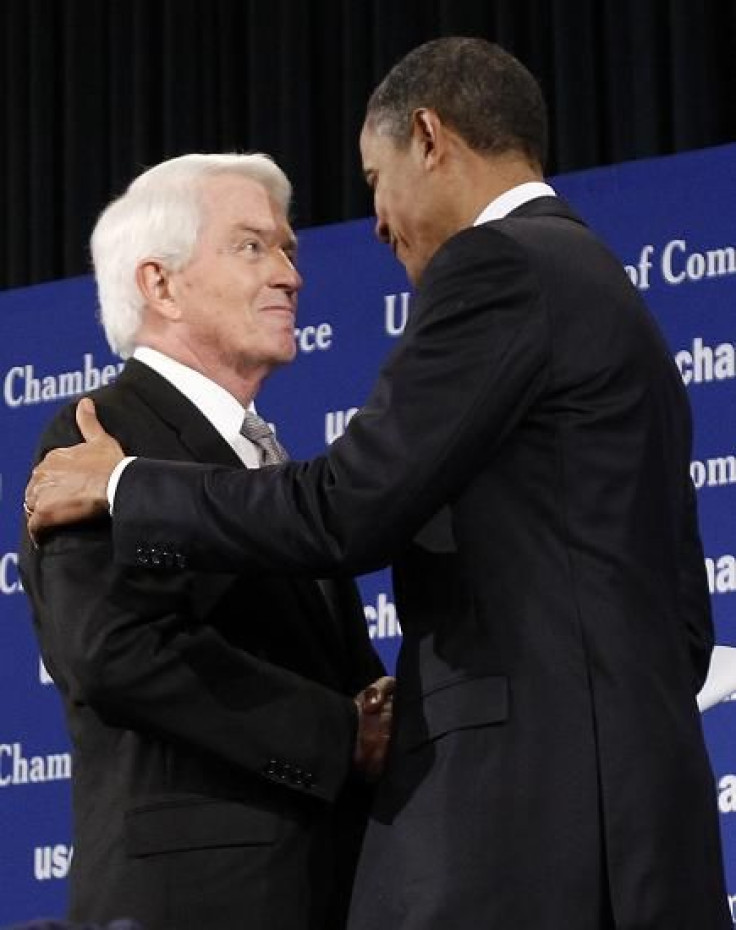 U.S. President Barack Obama (R) is greeted by Chamber of Commerce President Tom Donohue as he arrives to address the crowd in Washington, February 7, 2011.