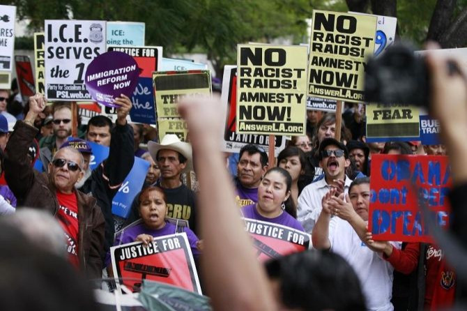 Demonstrators chant outside of the LA Federal Building during an Occupy ICE (Immigration Customs and Enforcement) protest march in Los Angeles December 15, 2011.