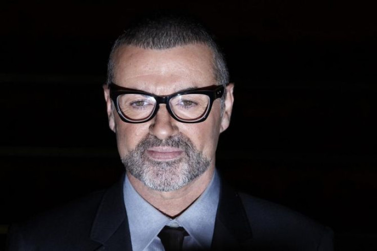 British singer George Michael poses for photographers before a news conference at the Royal Opera House in central London May 11, 2011.