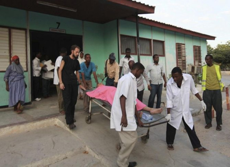 Madina hospital staff help to wheel an injured Medecins Sans Frontieres (MSF) personnel on a stretcher south of capital Mogadishu December 29, 2011.