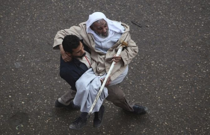 An man is carried by a volunteer