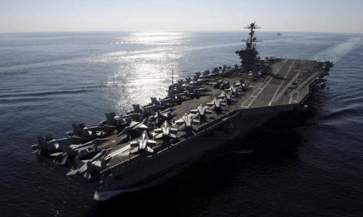 The aircraft carrier USS John C. Stennis transits the Straits of Hormuz in this U.S. Navy handout photo dated November 12, 2011.