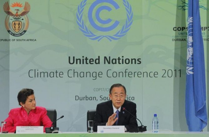 United Nations Framework Convention on Climate Change Executive Secretary Christiana Figueres listens as UN Secretary-General Ban Ki-moon addresses a media conference at the UN Climate Change conference (COP17) in Durban, December 6, 2011.