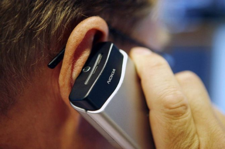 Person speaks on his mobile phone.