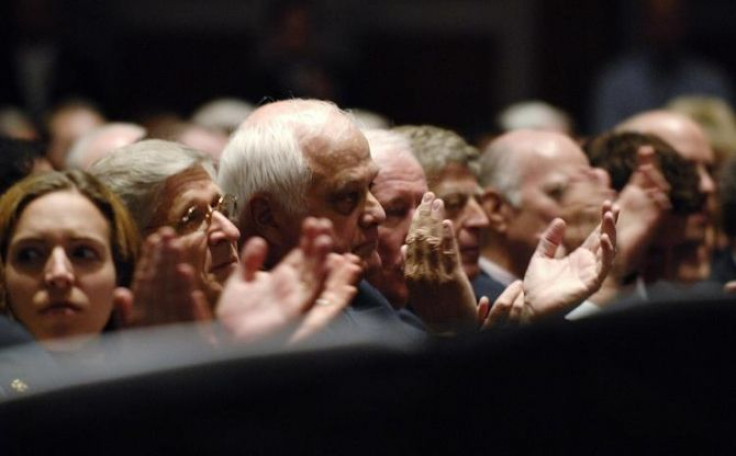 Attendees applaud as U.S. President Barack Obama delivers remarks on the health care system at the annual meeting of the American Medical Association in Chicago, Illinois June 15, 2009.