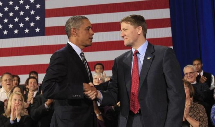 U.S. President Barack Obama shakes hands with Richard Cordray (R) after appointing him to head the Consumer Financial Protection Bureau during a trip to Cleveland, Ohio January 4, 2012.
