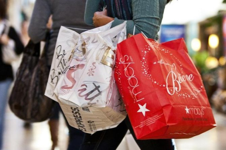 A customer carries shopping bags at South Park mall in Charlotte, North Carolina November 25, 2011.