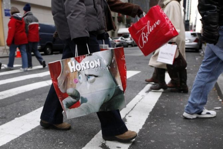 Shoppers carry bags as they walk down Fifth Avenue in New York, December 6, 2008.