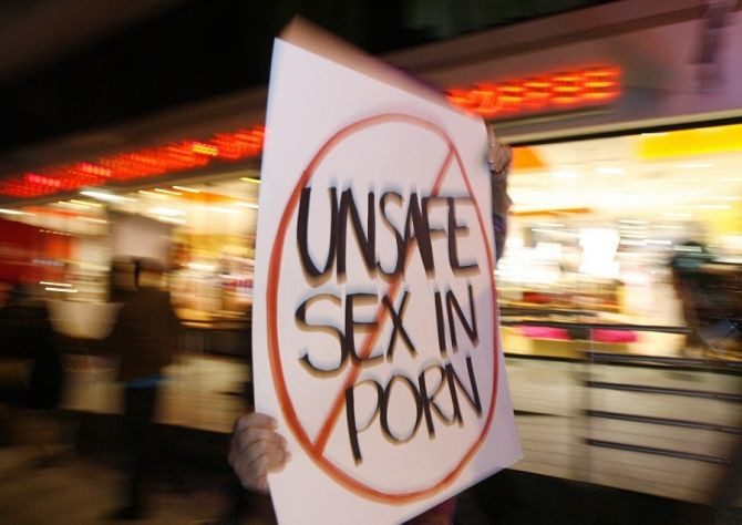 An activist holds a sign