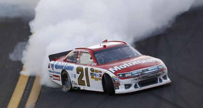 Sprint Cup Series driver Trevor Bayne (21) does a burn-out after winning the NASCAR Sprint Cup Series Daytona 500 race at the Daytona International Speedway in Daytona Beach, Florida February 20, 2011.