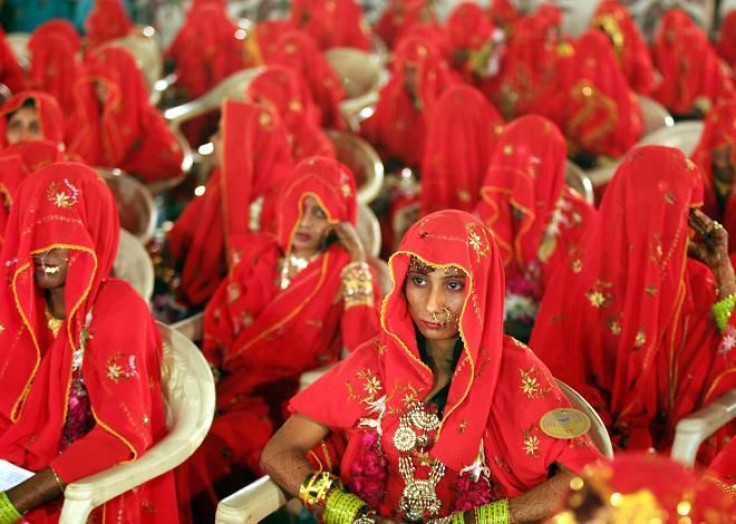 Indian Muslim brides sit during a mass wedding ceremony in the western Indian city of Ahmedabad March 10, 2007.