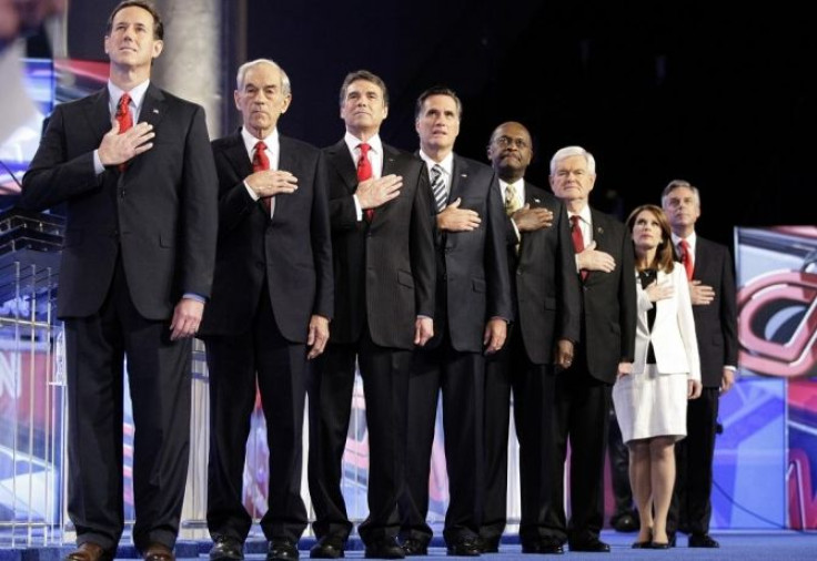 GOP candidates stand at attention during the singing of the national anthem during the CNN GOP National Security debate in Washington