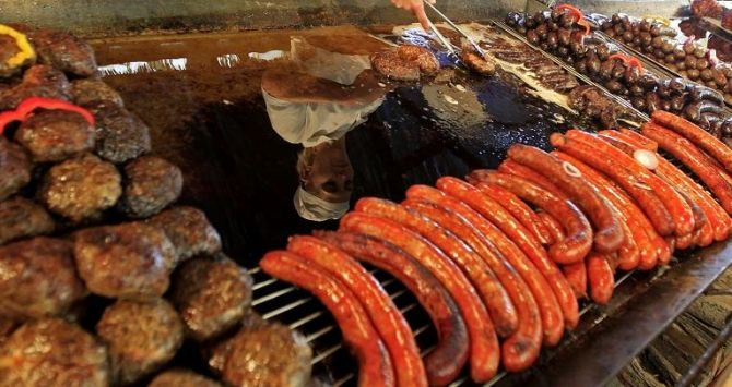 A chef cooks sausages during Europe's biggest sausage festival in Bekescsaba, 240 km (150 miles) southeast of Budapest, October 29, 2011.