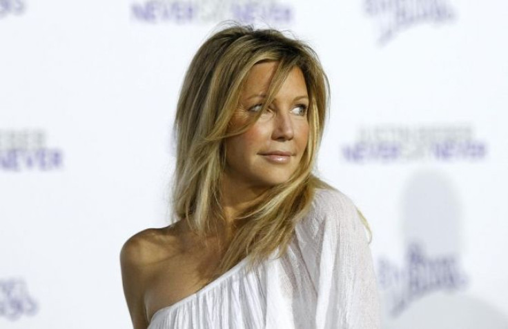 Actress Heather Locklear poses at the premiere of the documentary &quot;Justin Bieber: Never Say Never&quot;