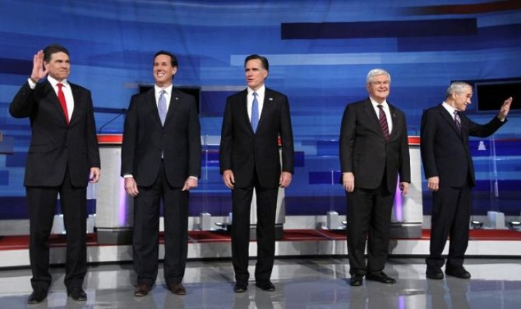 Republican presidential candidates (L-R) Texas Governor Rick Perry, former U.S. Senator Rick Santorum (R-PA), former Massachusetts Governor Mitt Romney, former House Speaker Newt Gingrich and U.S. Rep. Ron Paul (R-TX), stand on stage before participating