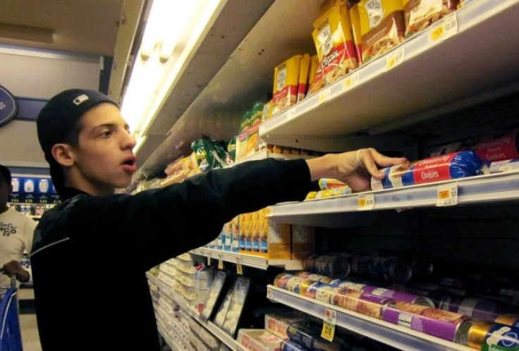 Tristan Williams, a student at Columbia High School in Maplewood, New Jersey, shops for products at a supermarket during a special education program aimed at teaching students life skills, June 15, 2011.