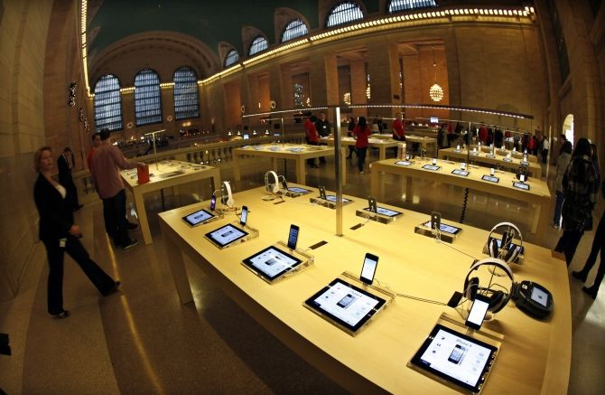 Apple iPad tabelts and iPhones are displayed inside the newest Apple Store in New York City's Grand Central Station December 7, 2011, during a press preview of the store, which opens to the public on Friday.
