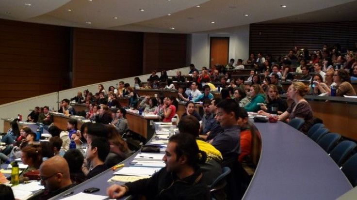College students attend lecture in a classroom.