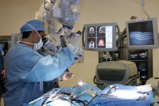 Surgeon performs a minimally invasive procedure to surgically remove a pituitary tumor.