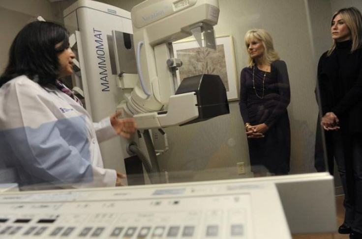Dr. Costanza Cocilovo gives Jill Biden, wife of U.S. Vice President Joe Biden, and actress Jennifer Aniston a tour of a mammography lab at the INOVA Breast Care Institute in Alexandria, Virginia, October 3, 2011.