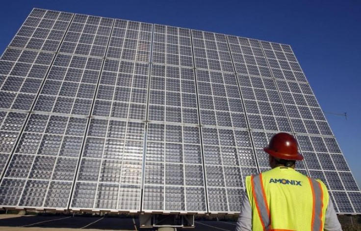 Amonix field engineer Brandon Flemington visually inspects solar panel cells at the Lyle Center on the Cal Poly Pomona campus in Pomona, California January 17, 2012.