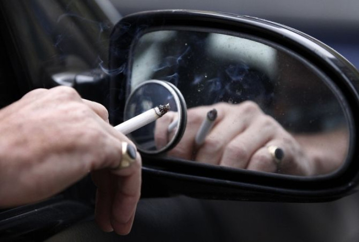 A man smokes a cigarette