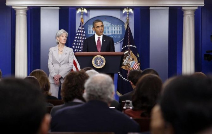 U.S. President Barack Obama talks next to Secretary of HHS Kathleen Sebelius about contraceptive care funding in the press room of the White House.