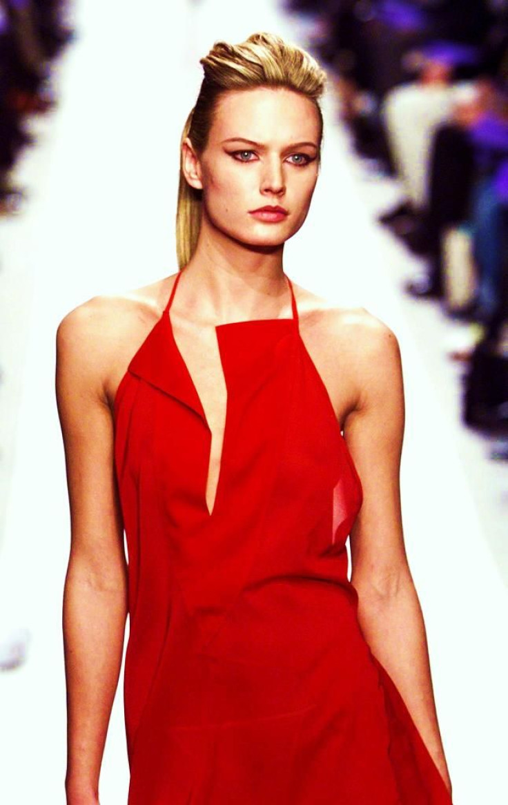 A model for Italian designer Mario Valentino presents this red long evening dress as part of his Spring-Summer 1999 Haute Couture fashion collection.