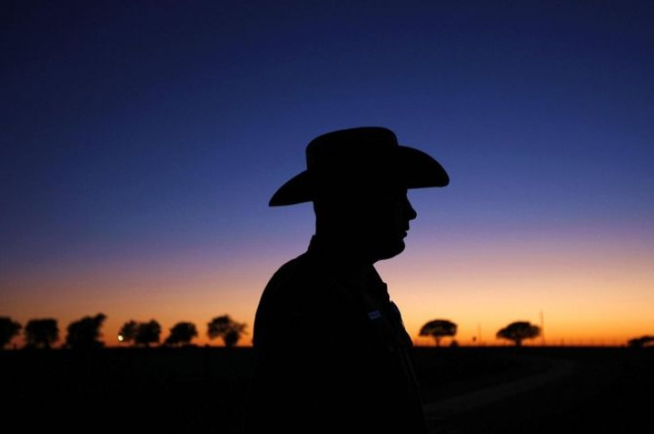 A Texas state trooper waits along Prairie Chapel Road