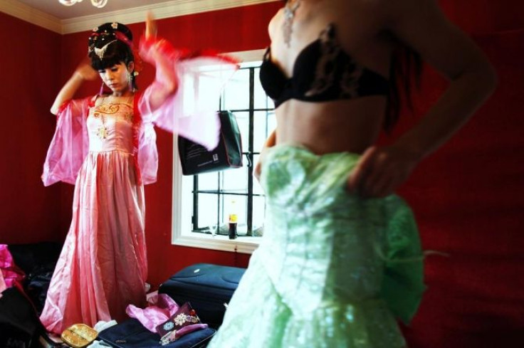 Drag queens get ready for China's first Gay Pride week at a bar in Shanghai June 13, 2009.