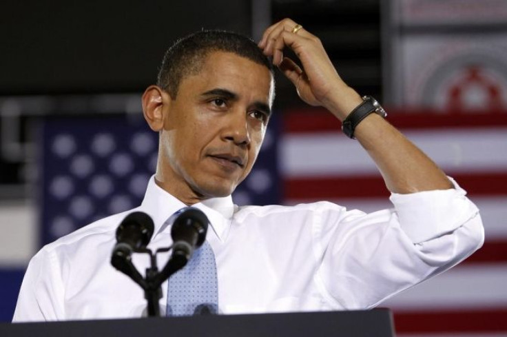 US President Obama pauses as he speaks about health insurance reform during a visit to Portland