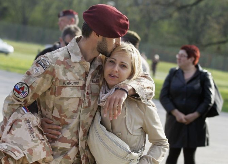 soldier kissing his wife