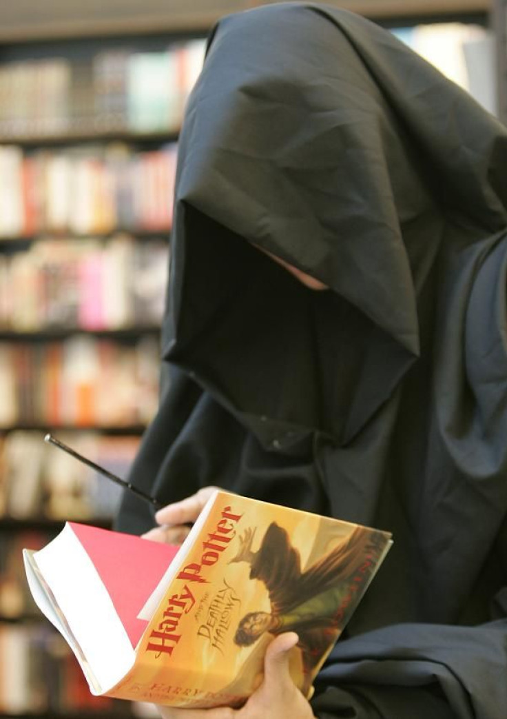 A Harry Potter fan, dressed as the character Lord Voldemort, browses the new release of J.K. Rowling's &quot;Harry Potter and the Deathly Hallows&quot; at a bookstore in Manila July 21, 2007.